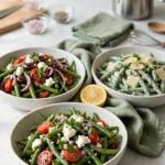 Three green bean salads in stoneware bowls: tomato feta, Mediterranean and creamy Parmesan
